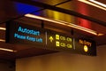 Illuminated travelator and directional signs Royalty Free Stock Photo