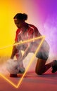 Illuminated triangle over biracial female rugby player with ball kneeling on gradient background