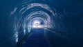 An illuminated tunnel inside the glacier at Mer De Glace Chamonix Royalty Free Stock Photo