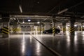 Illuminated underground car park, parking spaces in the car park. Royalty Free Stock Photo