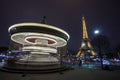 Illuminated vintage carousel and Eiffel Tower at night, Paris Royalty Free Stock Photo