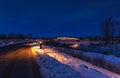 Illuminated Walkway By A Snowy Peace Bridge