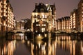 Illuminated water castle in Hamburgs old warehouse district Royalty Free Stock Photo