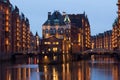 Illuminated water castle in Hamburgs old warehouse district