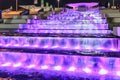 Illuminated waterfall fountain cascade by Olympic Park enchants with its beautiful play of water and light