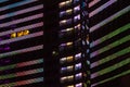 Illuminated windows of multistory building at night Royalty Free Stock Photo