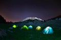 Illuminated yellow camping tent under stars at night Royalty Free Stock Photo
