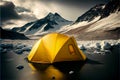 Illuminated yellow tent wild camping in the mountains under blue sky.