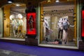 Illuminated showcases with mannequins on Rome streets