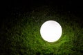 Illuminating conglobate ground garden lamp of white color. Royalty Free Stock Photo