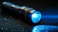 Illuminating a dark, wet surface with its bright beam, the flashlight shines brightly Royalty Free Stock Photo