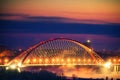 Illumination of Bugrinskiy bridge on the sunset