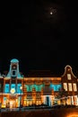 Illumination building and moon in the sky