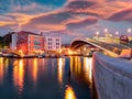 Illumitaned spring sunrise in Venice, Italy, Europe. Colorful morning view of Constitution Bridge. Magnificent Mediterranean seasa