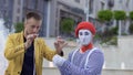 Illusionist showing trick with ring and rope for the mime