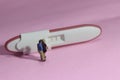 Illustration photo for Lovely moment, Young Couple Mini figure Toy kissing beyond Pregnancy test pack with positive result Royalty Free Stock Photo