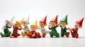 Illustrate a group of playful elf figurines in various poses on white background