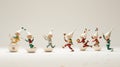 Illustrate a group of playful elf figurines in various poses on white background
