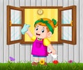 The daily activity girl cleaning the window in the morning Royalty Free Stock Photo