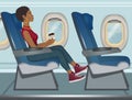 Girl travels by plane in economy class