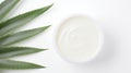 Aloe vera cream with aloe vera leaves on white