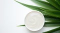 Aloe vera cream with aloe vera leaves on white