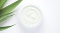 Aloe vera cream with aloe vera leaves on white