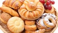 An illustration of an assortment of fresh pastries in wicker bowl isolated on white