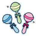 Illustration of baby rattles in blue green pink and yellow