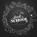 Back to school lettering in doodle circle on blue chalkboard background Royalty Free Stock Photo