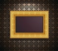 background frame for a picture, gilded with an interwoven volumetric pattern hanging on a wall with wallpaper Royalty Free Stock Photo