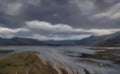 Illustration of a beautiful moody landscape of a lake stream near the mountains