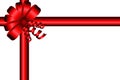 Red gift bow with ribbons for greeting design. Royalty Free Stock Photo