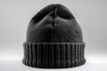 A black beanie hat viewed from the front in product photography with studio lighting against a white background. the image ha Royalty Free Stock Photo