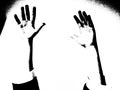 Two hands lifted high in air in black and white