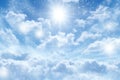 Blue sky background with white clouds and sun Royalty Free Stock Photo