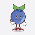 Blueberry Fruit cartoon mascot character on a waiting gesture