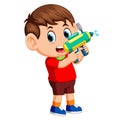 Boy playing with water gun Royalty Free Stock Photo