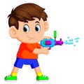 Boy playing with water gun Royalty Free Stock Photo