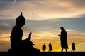 Buddhist monks at the temple at sunset Royalty Free Stock Photo