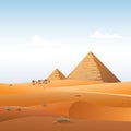 Camel caravan in wild Africa pyramids landscape background Royalty Free Stock Photo