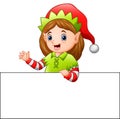 Cartoon christmas elf waving at a blank sign Royalty Free Stock Photo