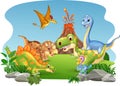 Cartoon happy dinosaurs in the jungle Royalty Free Stock Photo