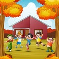 Cartoon happy kids in front house at autumns season Royalty Free Stock Photo