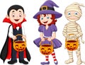 Cartoon kids with halloween costume holding pumpkin basket Royalty Free Stock Photo