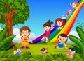 Cartoon kids sliding down the rainbow Royalty Free Stock Photo