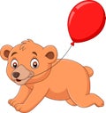 Cartoon little bear with a red balloon