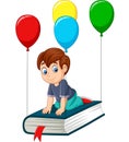 Cartoon schoolboy flying on a book Royalty Free Stock Photo