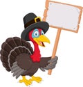 Cartoon turkey holding blank sign Royalty Free Stock Photo