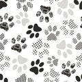 Seamless pattern with animal paw prints. Complex illustration print in black and white. Royalty Free Stock Photo